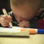 Our nephew Hayden coloring away at Doc's Pizza in Rupert
