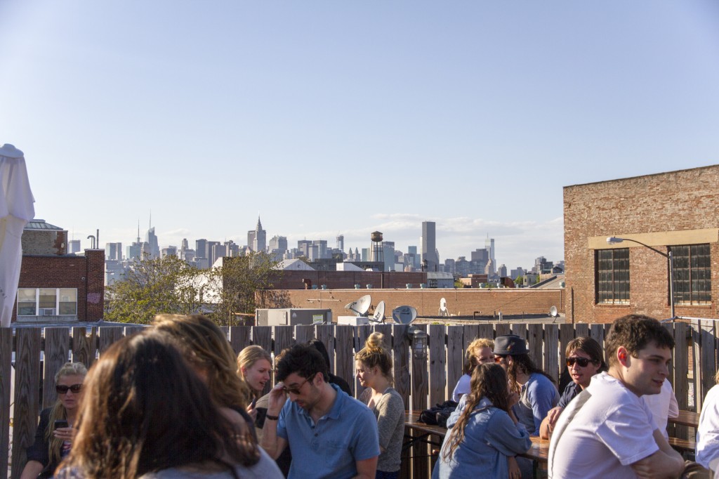 Rooftop bar in Brooklyn overlooking Manhattan, NY.