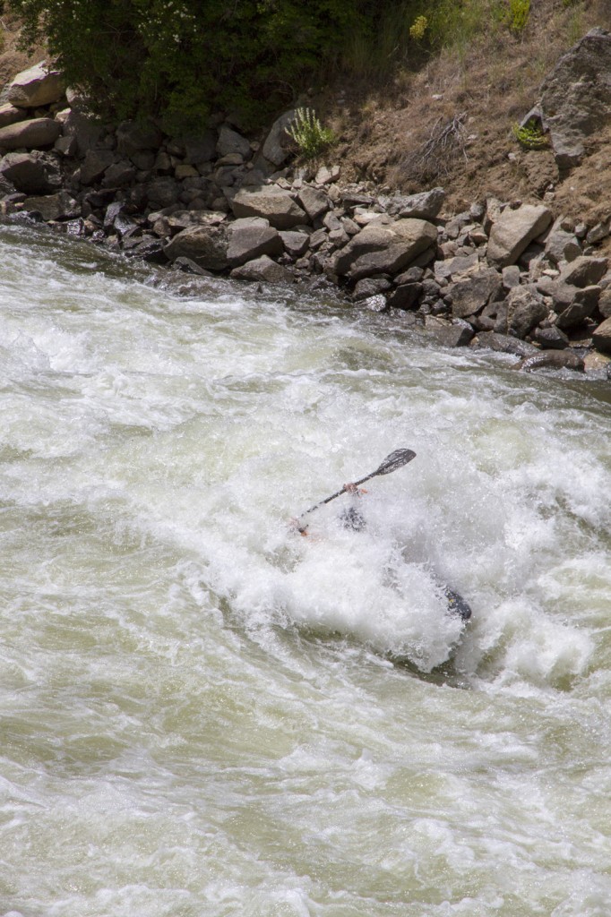 A rad kayaker hitting some waves on one of the many world class rivers we passed.