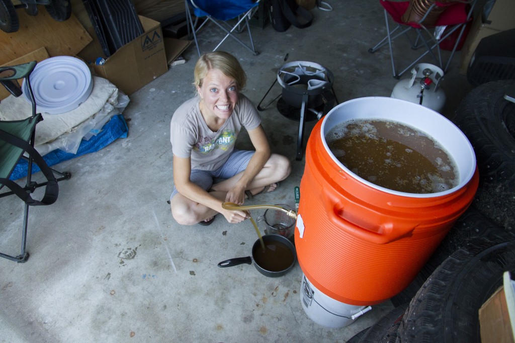 Rob is psyched! Clarifying the beer, one small pot at a time. 