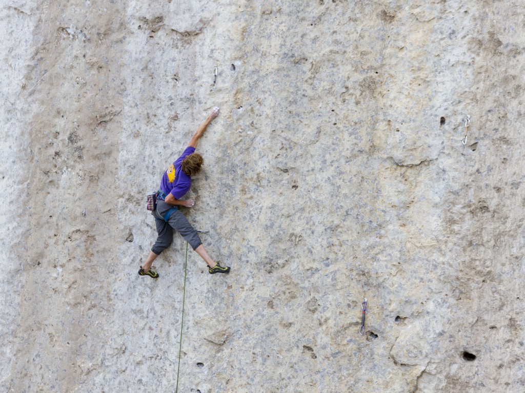 Starting into the lower boulder crux of Bushido (5.13b). Crimp like hell on a small polished crimp and uncork to a right hand mono before a nice pocket to clip from.