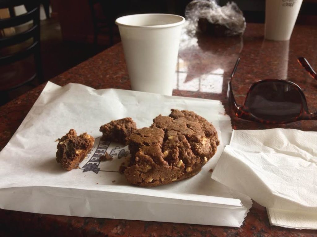 a cochocolate peanut butter cookie and coffee